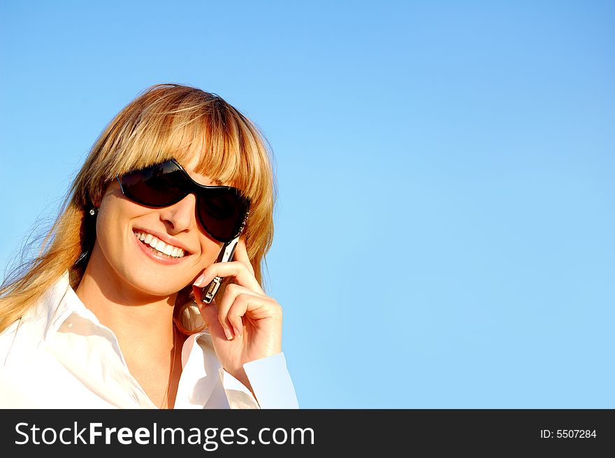 Beautiful young woman speaking the phone