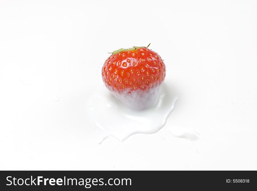 Red strawberry isolated on white dipped in yoghurt