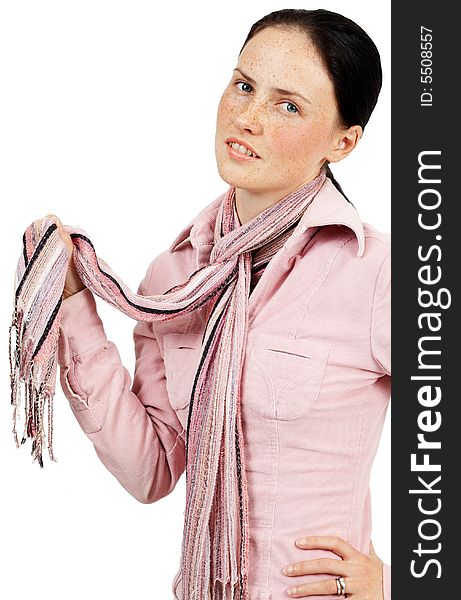 Portrait of a beautiful brunette woman with light blue eyes and freckles on her skin, wearing pink winter jacket and colorful scarf. Portrait of a beautiful brunette woman with light blue eyes and freckles on her skin, wearing pink winter jacket and colorful scarf