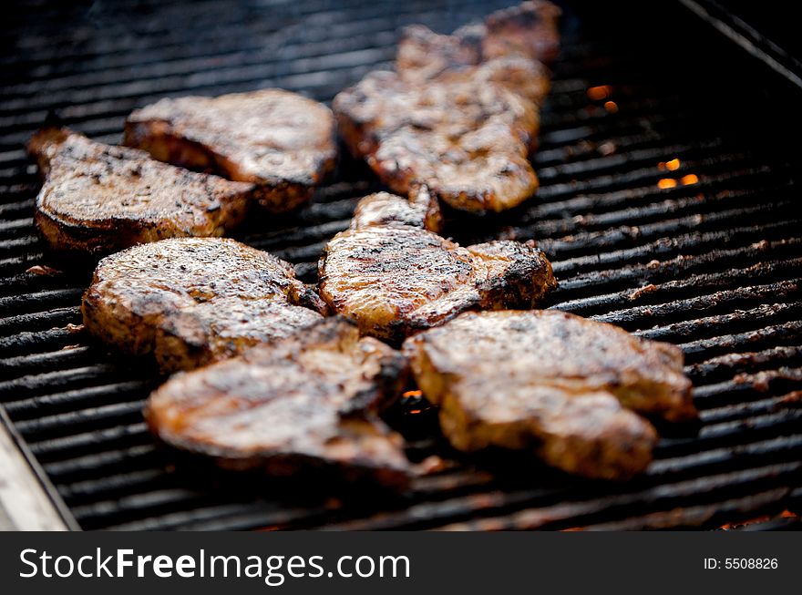 Juicy pork chops on a grill