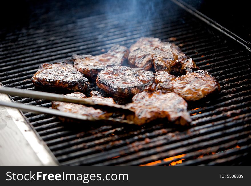 Juicy pork chops on a grill