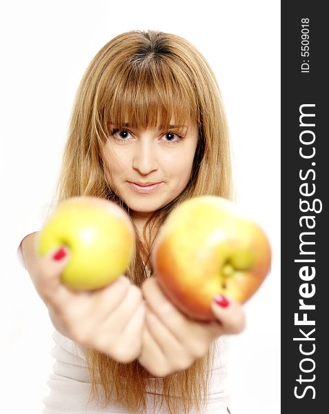 Beautiful young woman looking at apples. Isolated over white. Focus on girl