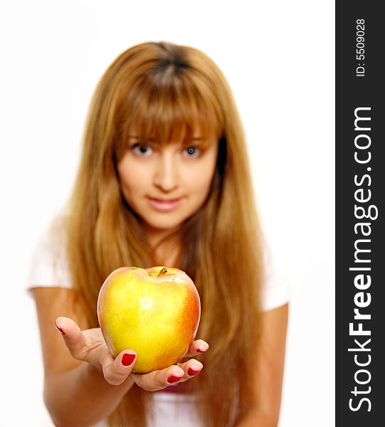 Beautiful young woman looking at apples. Isolated over white. Focus on girl