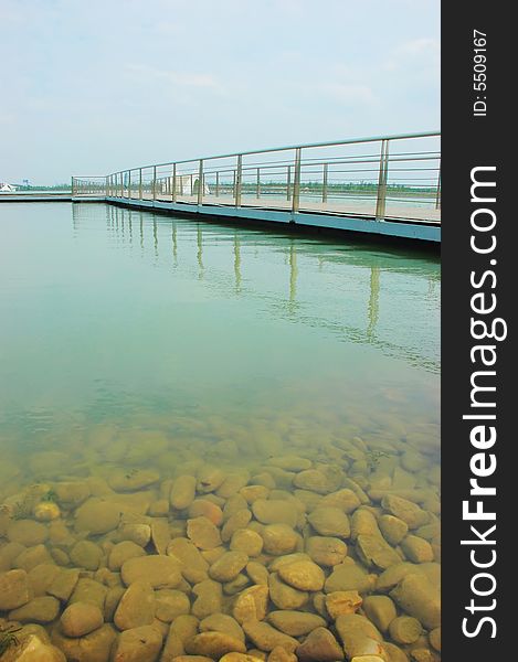 The bridge on the lake with the sky background