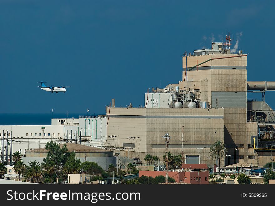 Airplane and power station near the sea