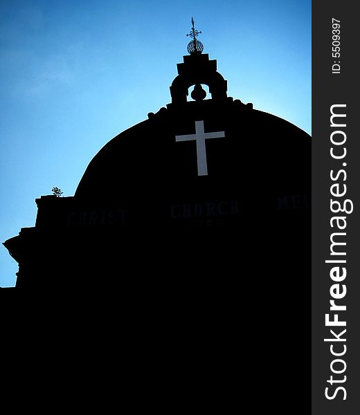 Asian Church, dark color building with blue sky background and low angle view.