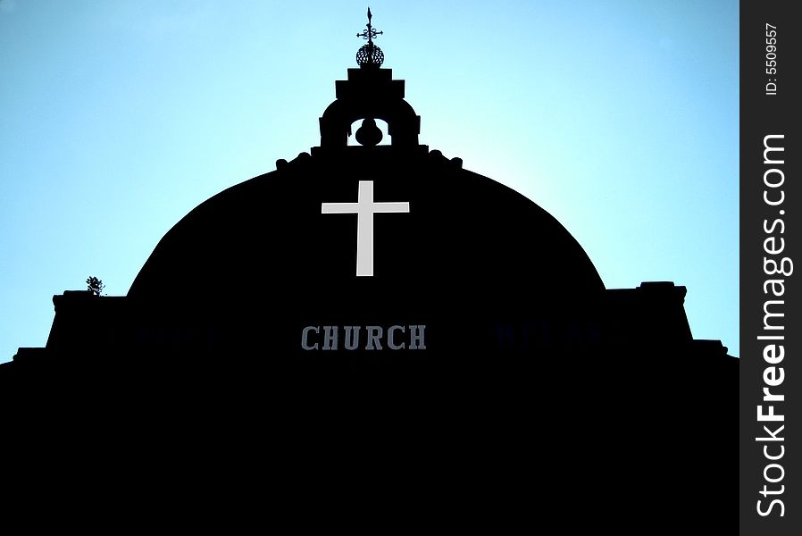 Asian Church, dark color building with blue sky background and low angle view.