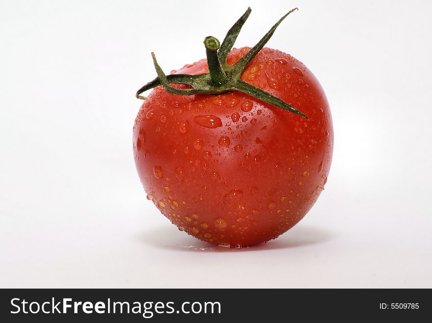 Red tomato in detail photo