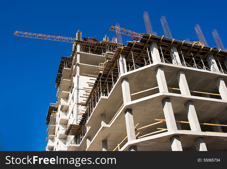 Construction of a multistory building on sunny summer day