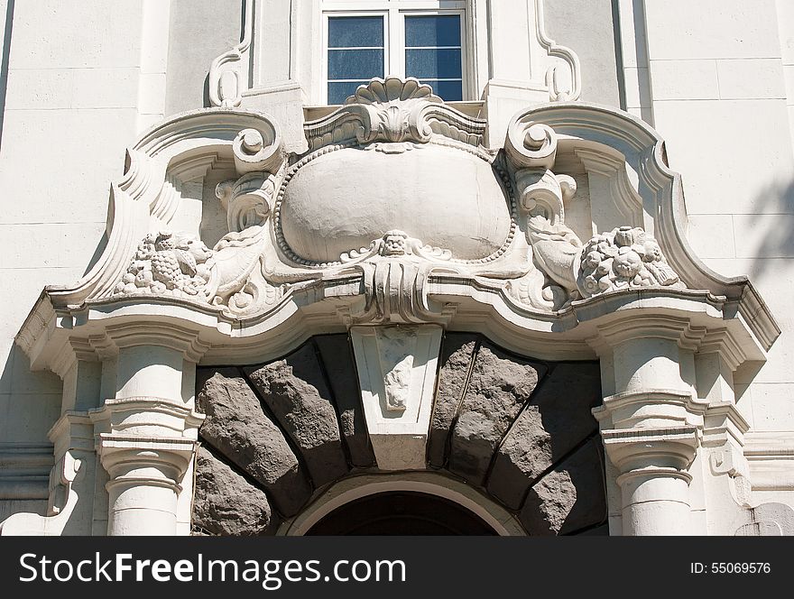 Old bas-relief above the entrance door closeup