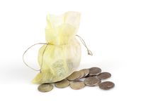 Coins In Gold Bag Royalty Free Stock Photography