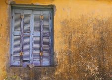 Blue Window Shuttered On Yellow Wall. Stock Photo Blue Window Shuttered On Yellow Wall. Stock Photo