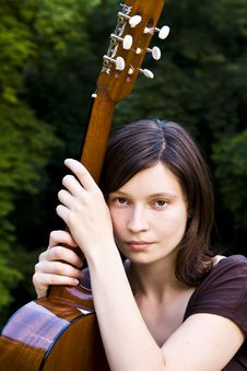 Young Woman With Guitar Stock Photography
