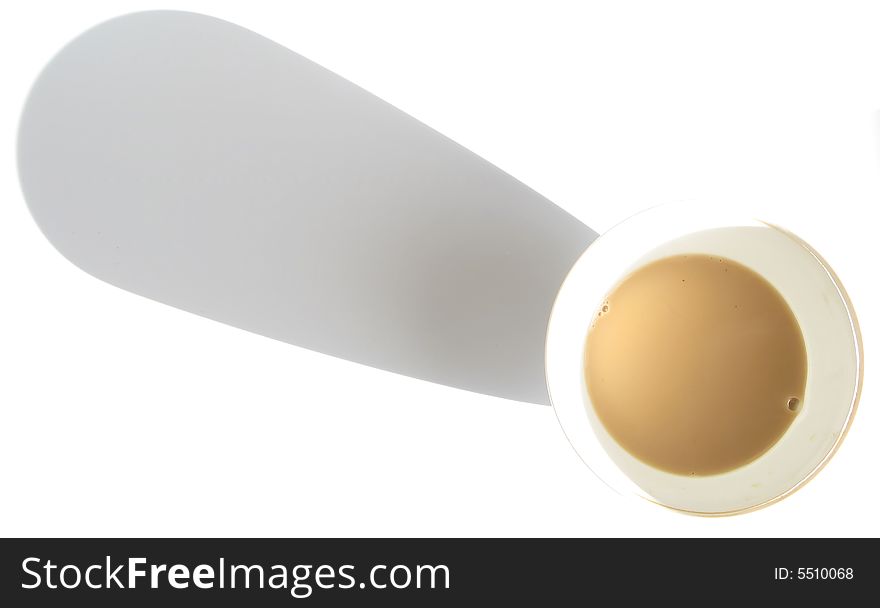 Tea with milk in the cup and shadow,cup of tea on a white background in contrasting light