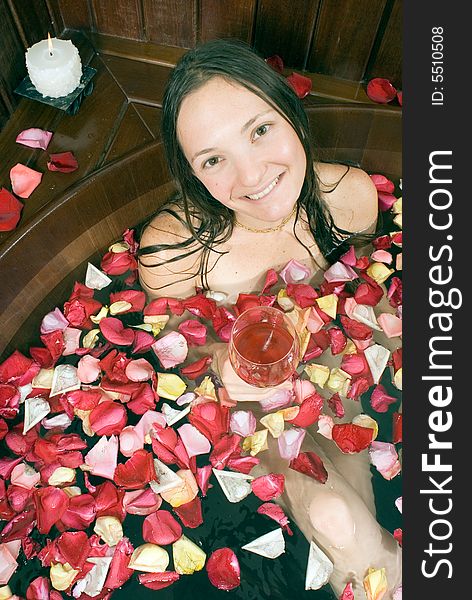Woman With Flowers In A Tub - Vertical