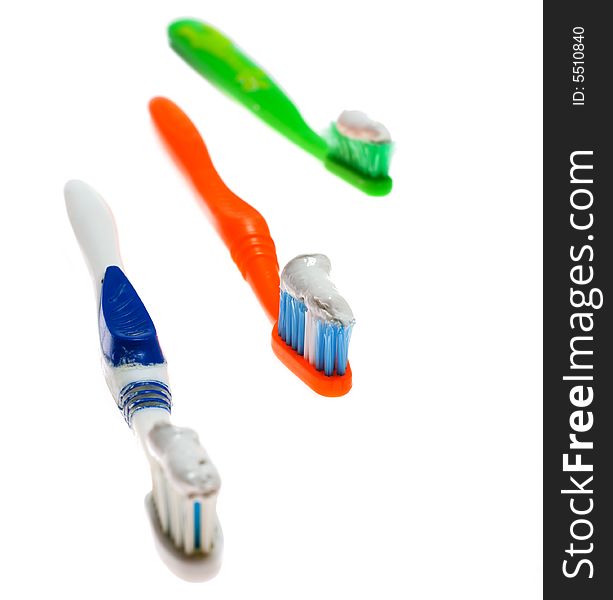 Three toothbrush with toothpase on its isolated on white backgrounds. Three toothbrush with toothpase on its isolated on white backgrounds