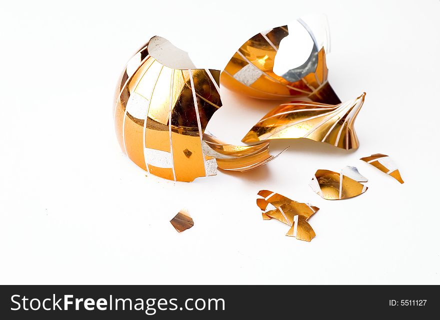 Broken glass christmas ball isolated on white background