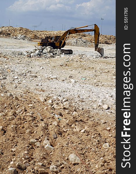 An old decay hydraulic excavator at construction site