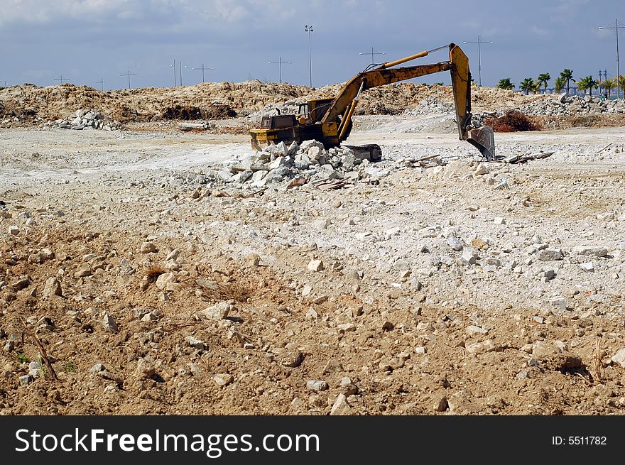 An old decay hydraulic excavator at construction site