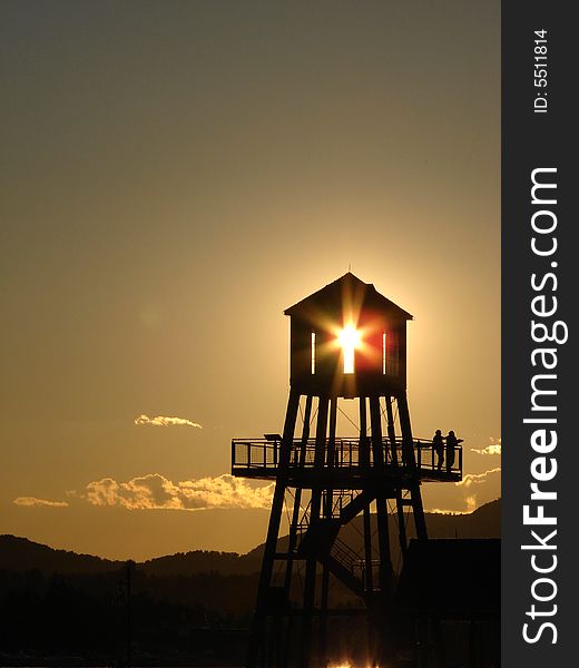 Observation tower in silhouette at sunset in Magog, province of Quebec, Canada. Observation tower in silhouette at sunset in Magog, province of Quebec, Canada