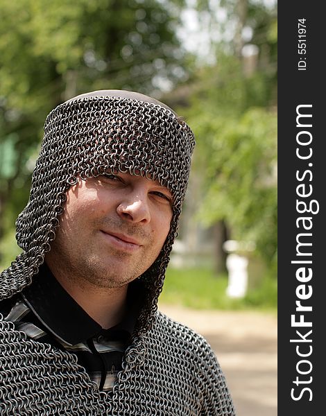 The man in a medieval chain mail. The man in a medieval chain mail