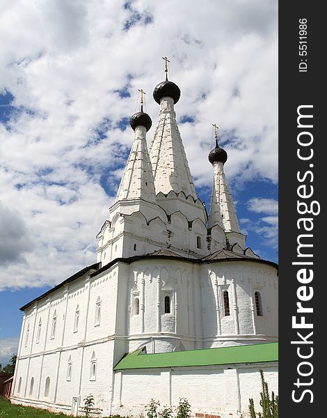 The white monastery on the sky background