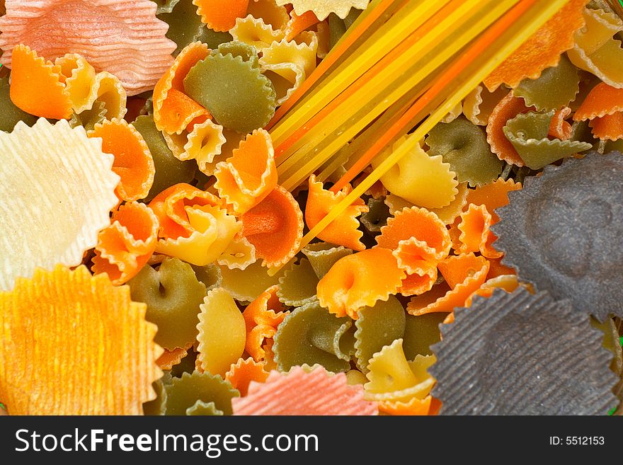 Assorted colorful uncooked pasta as background