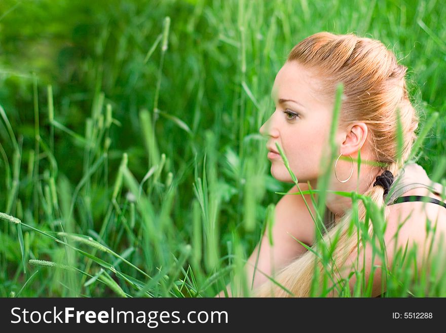 Young blond woman in the park