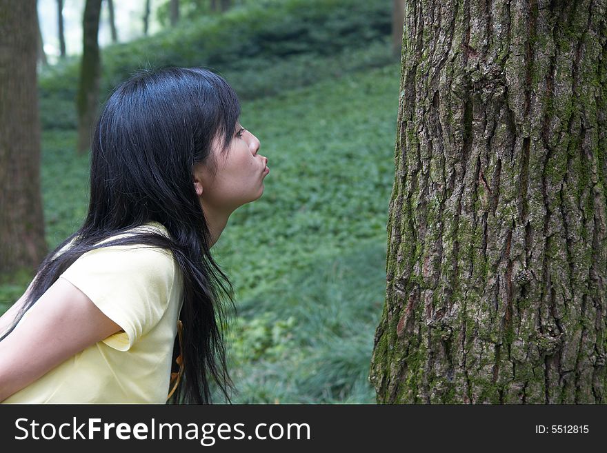 She is kissing the tree.