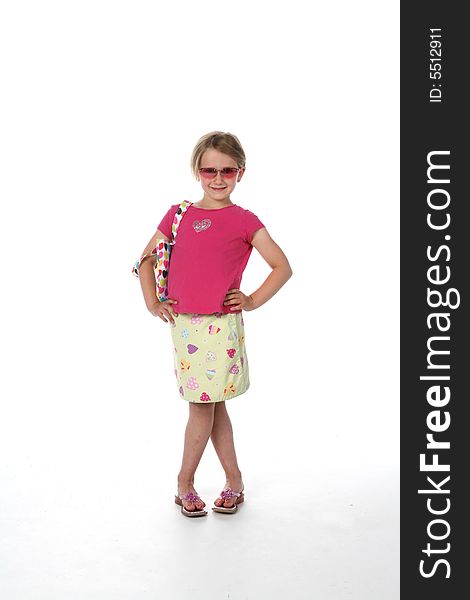 Cute girl in sunglasses, pink shirt and patterned skirt, looking like she's ready for a night on the town!