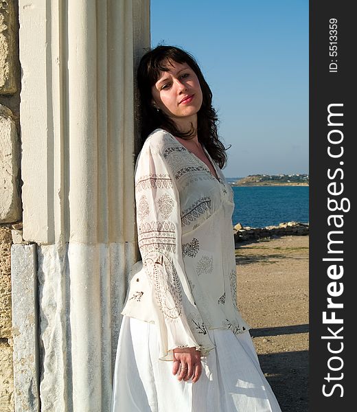 Young Lady Leaning Ancient Ruins