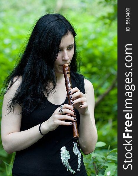 Gotic woman with an old flute