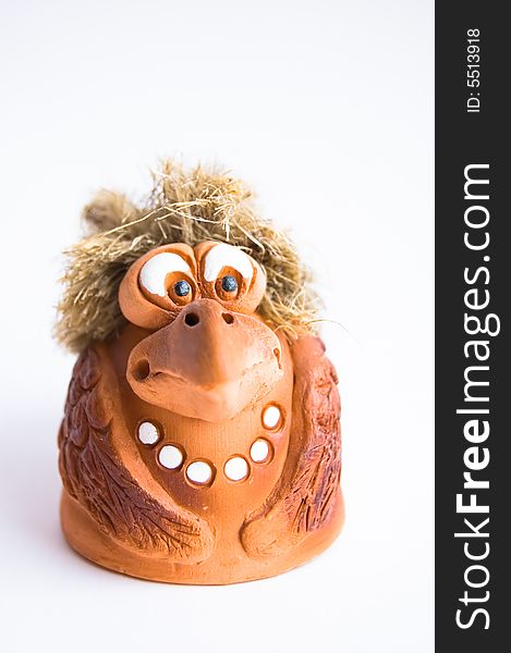 Funny clay figurine on light background