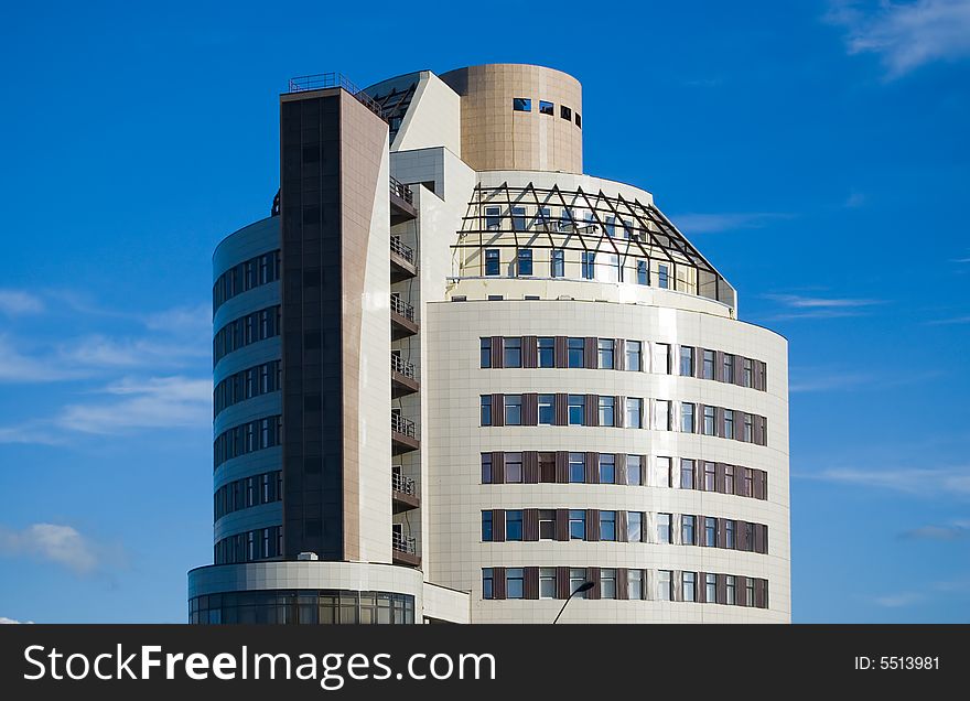 Modern office building. Blue sky background