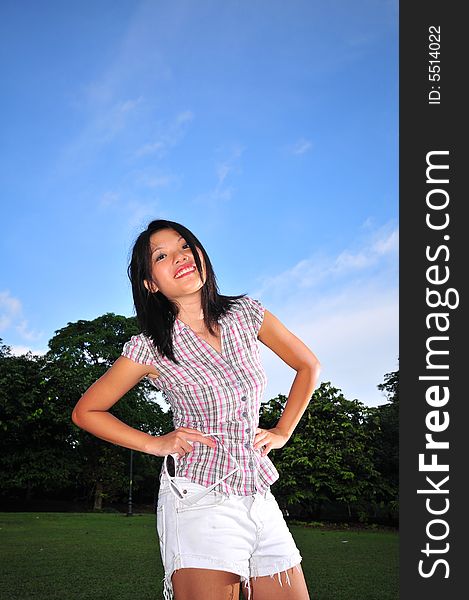 Picture of a Happy Girl out in the park. Indicative of mood, joyous occasion, promotion of healthy living and lifestyle. Picture of a Happy Girl out in the park. Indicative of mood, joyous occasion, promotion of healthy living and lifestyle.