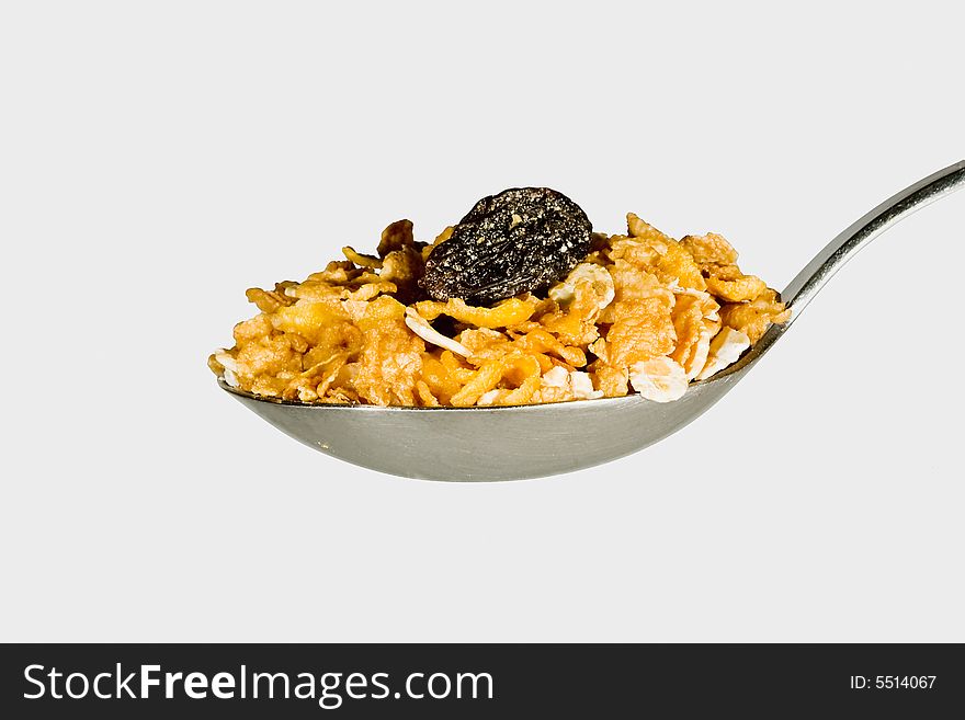 Spoon full of cereal on grey background