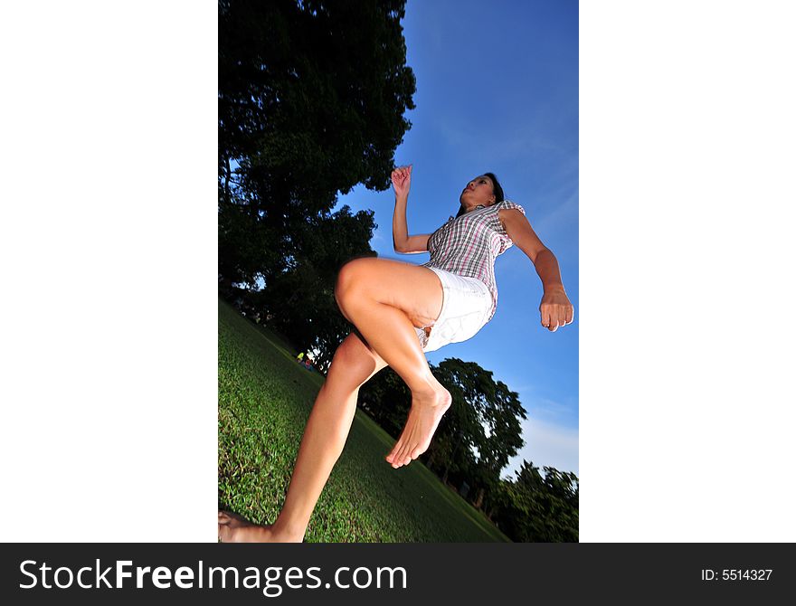 Picture of a Happy Girl out in the park. Indicative of mood, joyous occasion, promotion of healthy living and lifestyle. Picture of a Happy Girl out in the park. Indicative of mood, joyous occasion, promotion of healthy living and lifestyle.