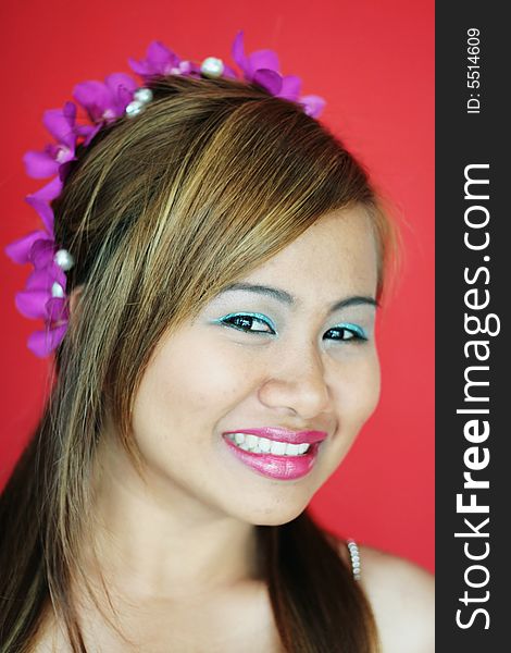 Gorgeous Thai woman with flowers in her hair - bride or bridesmaid image. Gorgeous Thai woman with flowers in her hair - bride or bridesmaid image.
