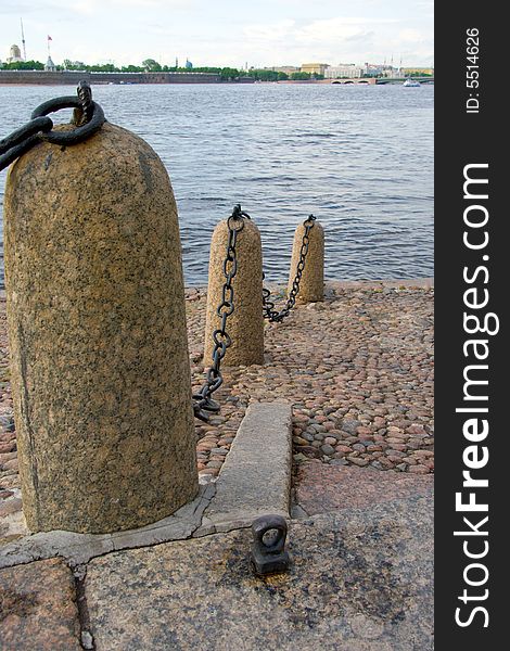 Granite river embankment with wharf chain in Saint-Petersburg