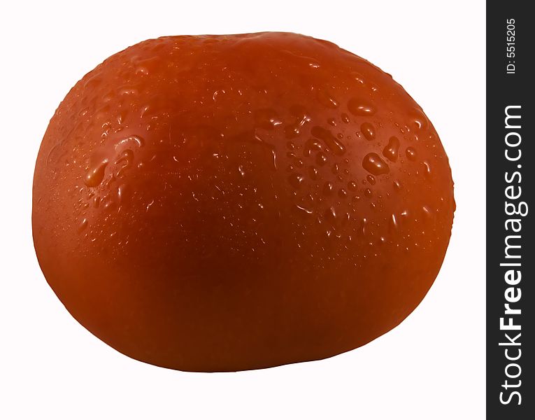 Ripe tomato with drops of water on a skin