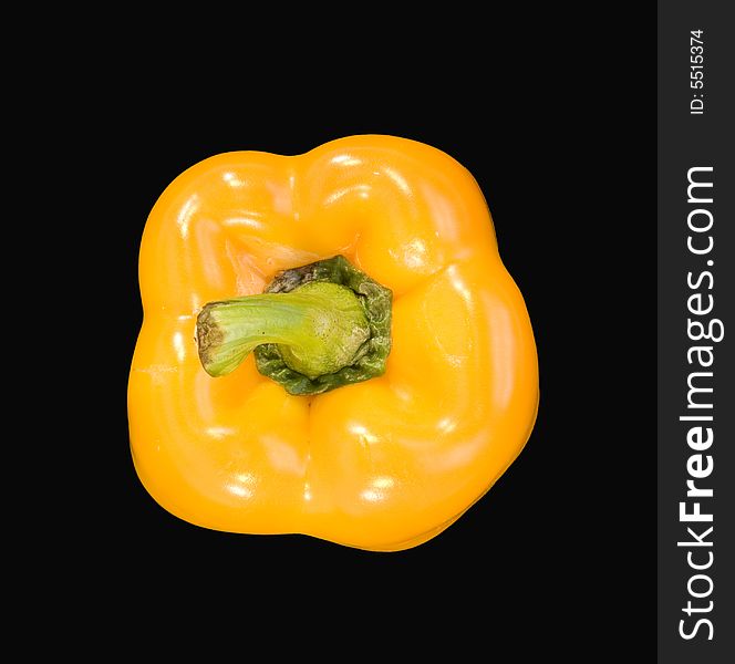 Sweet yellow capsicum pepper isolated on black