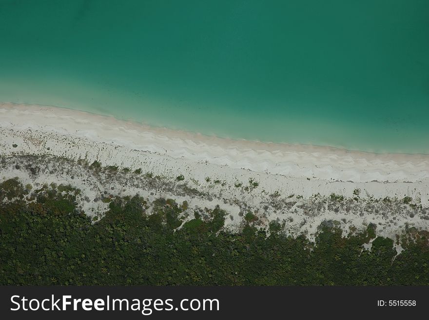Aerial taken over Holbox island virgin beach, Mexico. It shows the sand accumulation process. Aerial taken over Holbox island virgin beach, Mexico. It shows the sand accumulation process