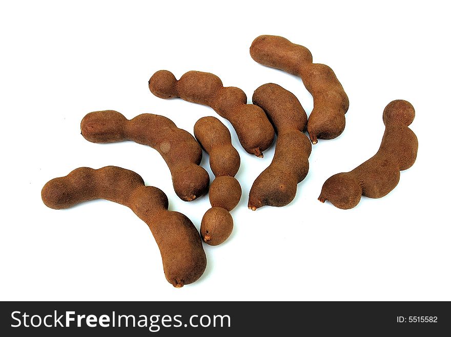 Tamarind is a tropical tree, native to tropical Africa, including Sudan and parts of the Madagascar dry deciduous forests. It was introduced into India so long ago that it has often been reported as indigenous there, and it was apparently from India that it reached the Persians and the Arabs who called it tamar hindi (Indian date, from the date-like appearance of the dried pulp), giving rise to both its common and generic names. The fruit pulp is edible and popular. It is used as a spice in both Asian and Latin American cuisines, and is also an important ingredient in Worcestershire sauce, HP sauce and the Jamaican-produced Pickapeppa sauce. The hard green pulp of a young fruit is very tart and acidic and is most often used as a component of savory dishes. The ripened fruit is sweeter, yet still distinctively sour, and can be used in desserts and sweetened drinks, or as a snack. In Thailand, there is a carefully cultivated sweet variety with little to no tartness grown specifically to be eaten as a fresh fruit.

The leaves are also distinctly tart in flavor, and are used in many soups in the North Eastern part of Thailand. In temples, especially in Asian countries, the pulp is used to clean brass shrine furniture, removing dulling and the greenish patina that forms. Tamarind is a tropical tree, native to tropical Africa, including Sudan and parts of the Madagascar dry deciduous forests. It was introduced into India so long ago that it has often been reported as indigenous there, and it was apparently from India that it reached the Persians and the Arabs who called it tamar hindi (Indian date, from the date-like appearance of the dried pulp), giving rise to both its common and generic names. The fruit pulp is edible and popular. It is used as a spice in both Asian and Latin American cuisines, and is also an important ingredient in Worcestershire sauce, HP sauce and the Jamaican-produced Pickapeppa sauce. The hard green pulp of a young fruit is very tart and acidic and is most often used as a component of savory dishes. The ripened fruit is sweeter, yet still distinctively sour, and can be used in desserts and sweetened drinks, or as a snack. In Thailand, there is a carefully cultivated sweet variety with little to no tartness grown specifically to be eaten as a fresh fruit.

The leaves are also distinctly tart in flavor, and are used in many soups in the North Eastern part of Thailand. In temples, especially in Asian countries, the pulp is used to clean brass shrine furniture, removing dulling and the greenish patina that forms.