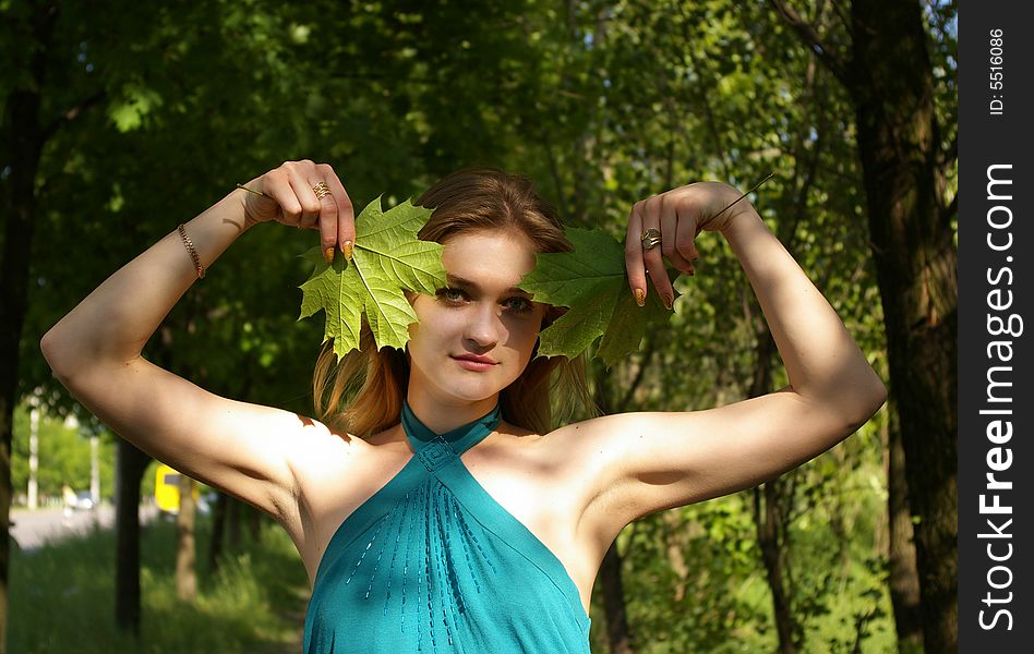 Woman holds maple leaves