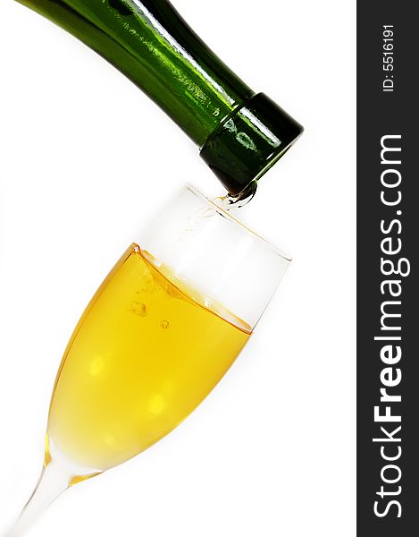 Pouring some white wine in glass, isolated on white. Pouring some white wine in glass, isolated on white