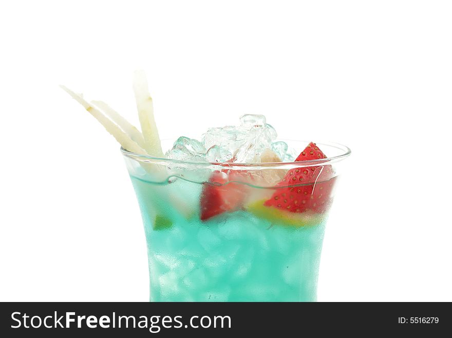 Tropical Acoholic Drink Made of Rum, Pineapple Juice, Blue Curacao, Sweet and Sour Mix. Slice of Apple and Strawberry as a Garnish. Tropical Acoholic Drink Made of Rum, Pineapple Juice, Blue Curacao, Sweet and Sour Mix. Slice of Apple and Strawberry as a Garnish.