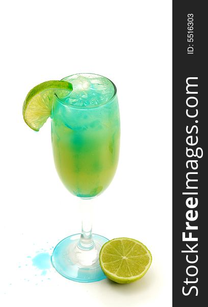 Refreshment Acoholic Drink with Martini, Blue Curacao, and Pineapple Juice. Lime Garnish. Isolated on White Background. Refreshment Acoholic Drink with Martini, Blue Curacao, and Pineapple Juice. Lime Garnish. Isolated on White Background.