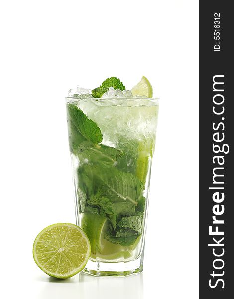 Refreshment Acoholic Drink made of White Rum, Sugar, Lime, Carbonated Water and Mint. Lime Garnish. Isolated on White Background. Refreshment Acoholic Drink made of White Rum, Sugar, Lime, Carbonated Water and Mint. Lime Garnish. Isolated on White Background.