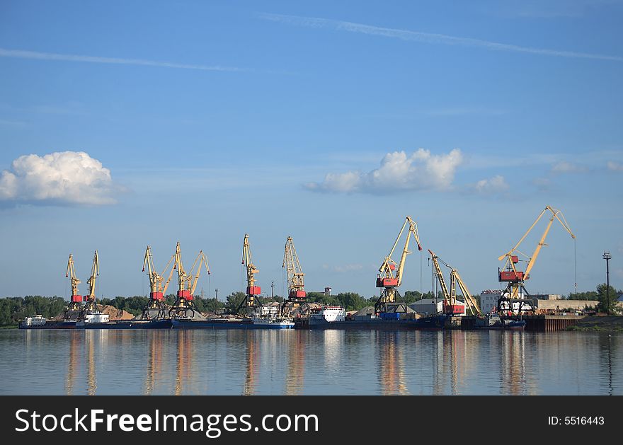 Panorama of cranes against the blue evening sky. Panorama of cranes against the blue evening sky