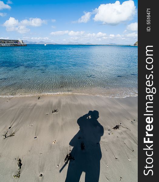 Shadow of a photographer on the beach